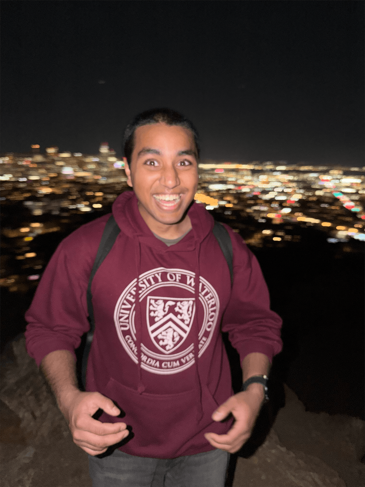 A teammate with San Francisco city lights in the background