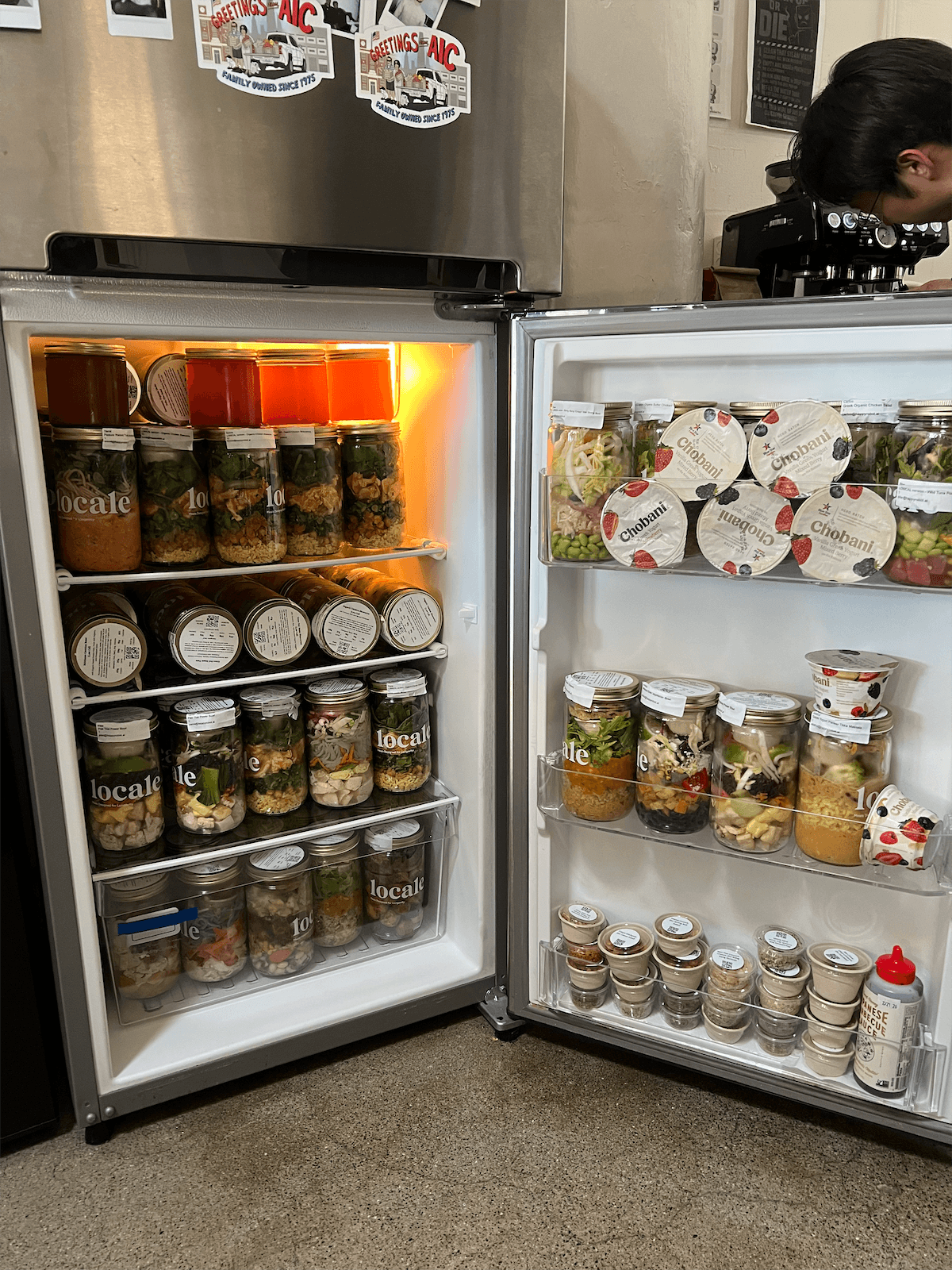 The office fridge stocked with lunches